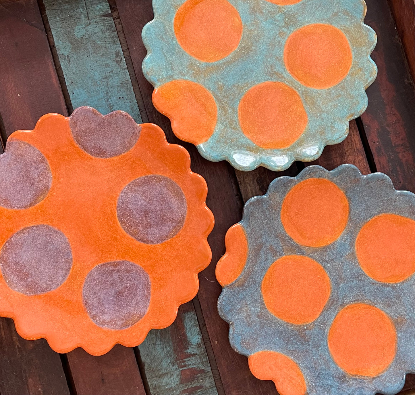 TurquoiseScalloped orange polka dot plate